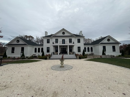 Technician performing concrete cleaning on a residential driveway in charlottesville va